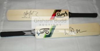 A group of four mini-bats signed by the Australian cricketing greats Ricky Ponting, Michael Clarke,