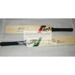 A group of four mini-bats signed by the Australian cricketing greats Ricky Ponting, Michael Clarke,