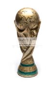 A resin full-size replica of the FIFA World Cup Trophy, realistically modelled,