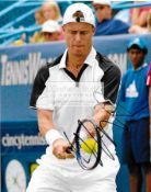 A group of seven photographs signed by tennis players, comprising: Lleyton Hewitt, Pat Cash,
