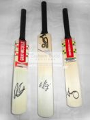 A group of four mini-bats signed by the Australian cricketers Steve Smith, David Warner,