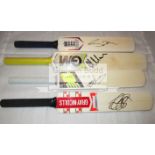 A group of four mini-bats signed by the current England cricketers Alastair Cook, Ben Stokes,