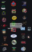 Ulster Grand Prix motorcycle year badges and programmes, 18 enamel on metal pin badges,