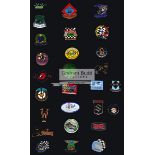 Ulster Grand Prix motorcycle year badges and programmes, 18 enamel on metal pin badges,