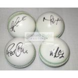 A group of four white leather cricket balls signed by the Australian players Glenn Maxwell,