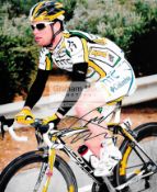 Colour photographs signed by the cyclists Mark Cavendish and André Greipel, 10 by 8in.