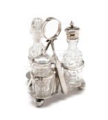 Silver plated three bottle cruet set, crossed cricket bats forming a tripod frame,