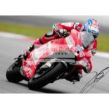 A group of four photographs signed by MotoGP greats Nicky Hayden, Casey Stoner,