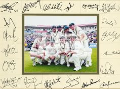 Signed photograph of the Australian 2001 Ashes Series winning cricket team, a central 8 by 10in.