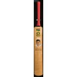 A cricket bat bearing an original artist drawn portrait of Hansie Cronje and the signatures of the