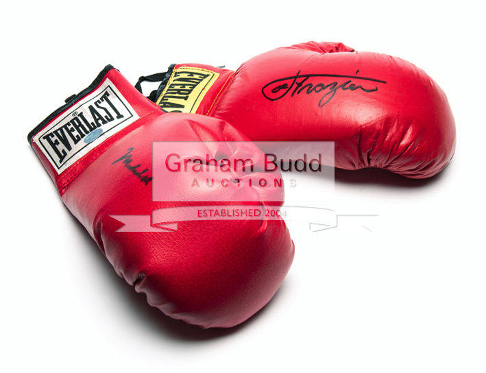 Boxing gloves signed by Muhammad Ali and Joe Frazier, two right-hand red Everlast gloves,