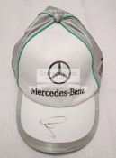Mercedes F1 caps signed by Lewis Hamilton & Nico Rosberg,