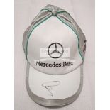 Mercedes F1 caps signed by Lewis Hamilton & Nico Rosberg,