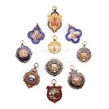 Ten medals relating to football in London, comprising a cased 9ct. gold & enamel London F.A.