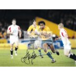 A group of four photographs signed by international rugby union players,