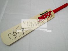 A trio of mini-bats signed by the West Indies cricketers Brian Lara,