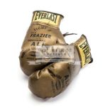 A pair of souvenir 'golden' gloves for the Joe Frazier v Muhammad Ali Fight II at Madison Square