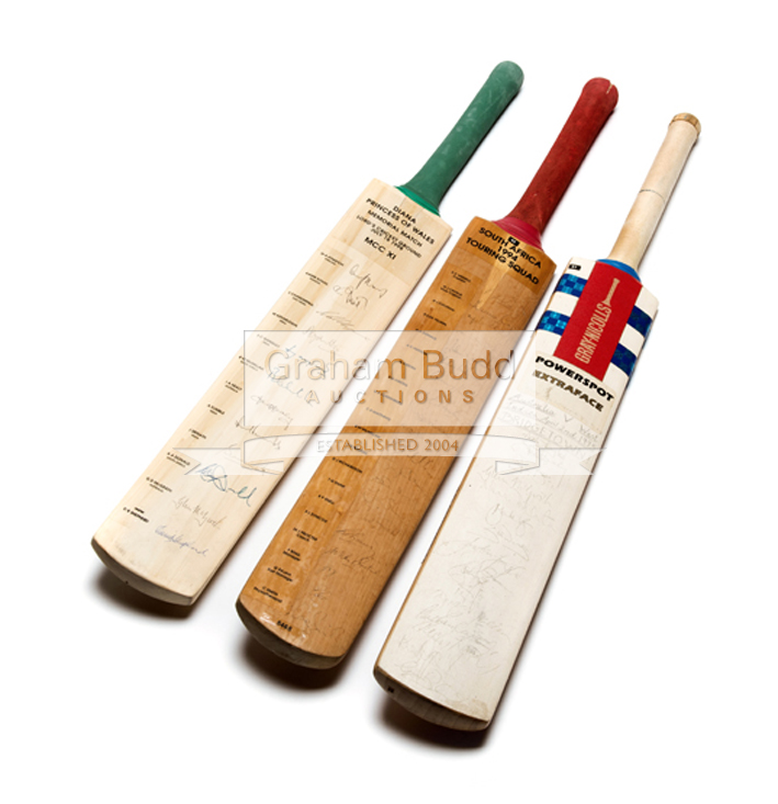 Three autographed cricket bats,