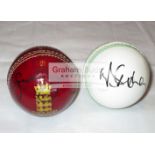 A group of four leather cricket balls signed by former England players,