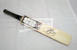 Autographed Sri Lanka cricket memorabilia, comprising a mini-bat and a 10 by 8in.