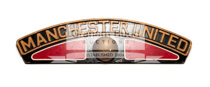 Manchester United replica locomotive nameplate, painted wood & plaster, length 88cm.