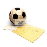 A football signed by cast members of the movie "Escape To Victory", including Pele, Bobby Moore,