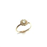 Yellow gold diamond solitaire ring. The round brilliant cut diamond weighing approx. 0.