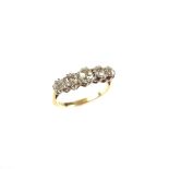 18 ct yellow gold and platinum five stone diamond ring. Set with five graduated old cut diamonds.