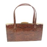 A Vintage python skin handbag, circa 1961. Purchased from Bobbys of Folkestone.