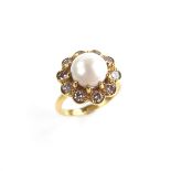 Yellow gold pearl and diamond cluster ring.