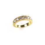 18 ct yellow gold diamond half eternity ring. Set with nine round brilliant cut diamonds.