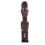 Tribal art: An African carved wood Yaka figure, Congo, 19th century.