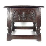 A carved oak stool, 19th century or ealier. With a hinged lid. 17.7 in (45 cm) height, 17.