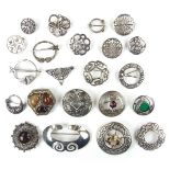 Collection of silver brooches and two base metal brooches.
