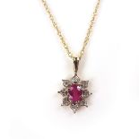 9 ct yellow gold ruby and diamond pendant necklace.