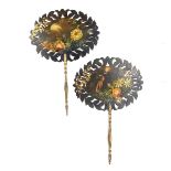 A pair of Victorian papier mache hand held fire screens.