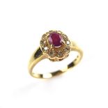 18 ct yellow gold ruby and diamond cluster ring.