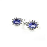 14 ct white gold tanzanite and diamond earrings.