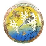 A Japanese porcelain charger, early 20th century.