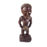 Tribal Art: An African tribal fetish Nkisi naked male ancestor figure, Congo, 20th century.
