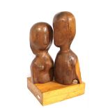 Carved Wood Sculpture, a Man and Woman. 14 ins. high, (35.5 cms.
