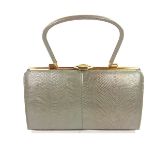 A Vintage grey lizard skin handbag, circa 1958. Purchased from Bobby & Co Ltd of Folkestone.