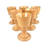 A set of six Scottish wooden wine goblets.