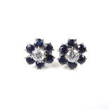18 ct white gold sapphire and diamond flower cluster earrings.