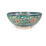 A large Iznik polychrome glazed pottery bowl. 13.6 in (34.6 cm) diameter.