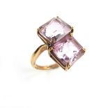 Yellow gold two stone amethyst ring. Set with two emerald cut amethysts measuring approx. 10.
