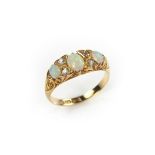 18 ct yellow gold opal and diamond three stone ring.