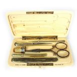 An ivory Asprey & Sons sewing set.