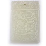 A Chinese white jade pendant plaque.