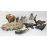 A group of eleven Inuit hardstone carvings comprising; seal, narwhal, bears, hippo, figure, eagle,